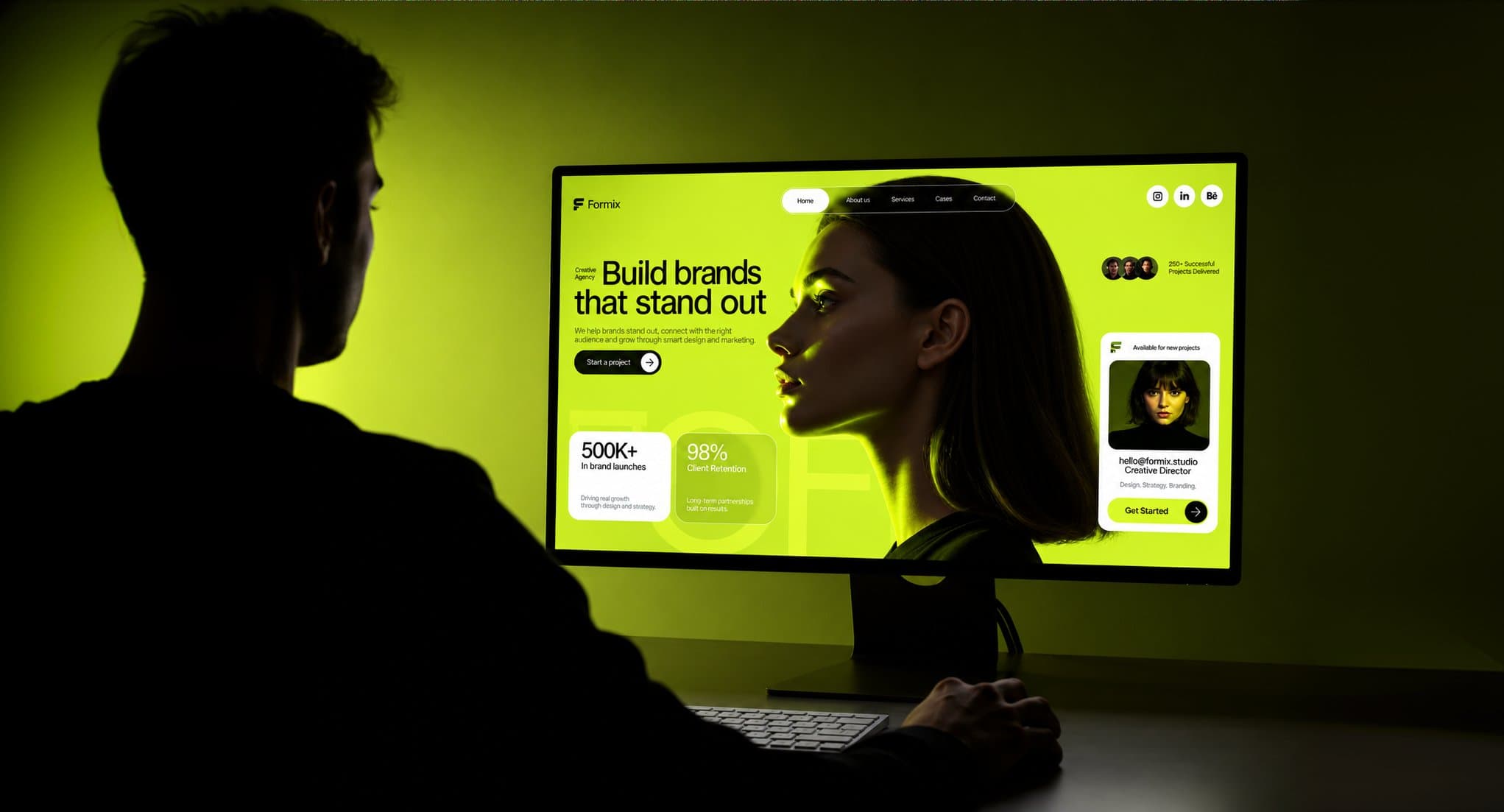 Designer reviewing a website on a large screen